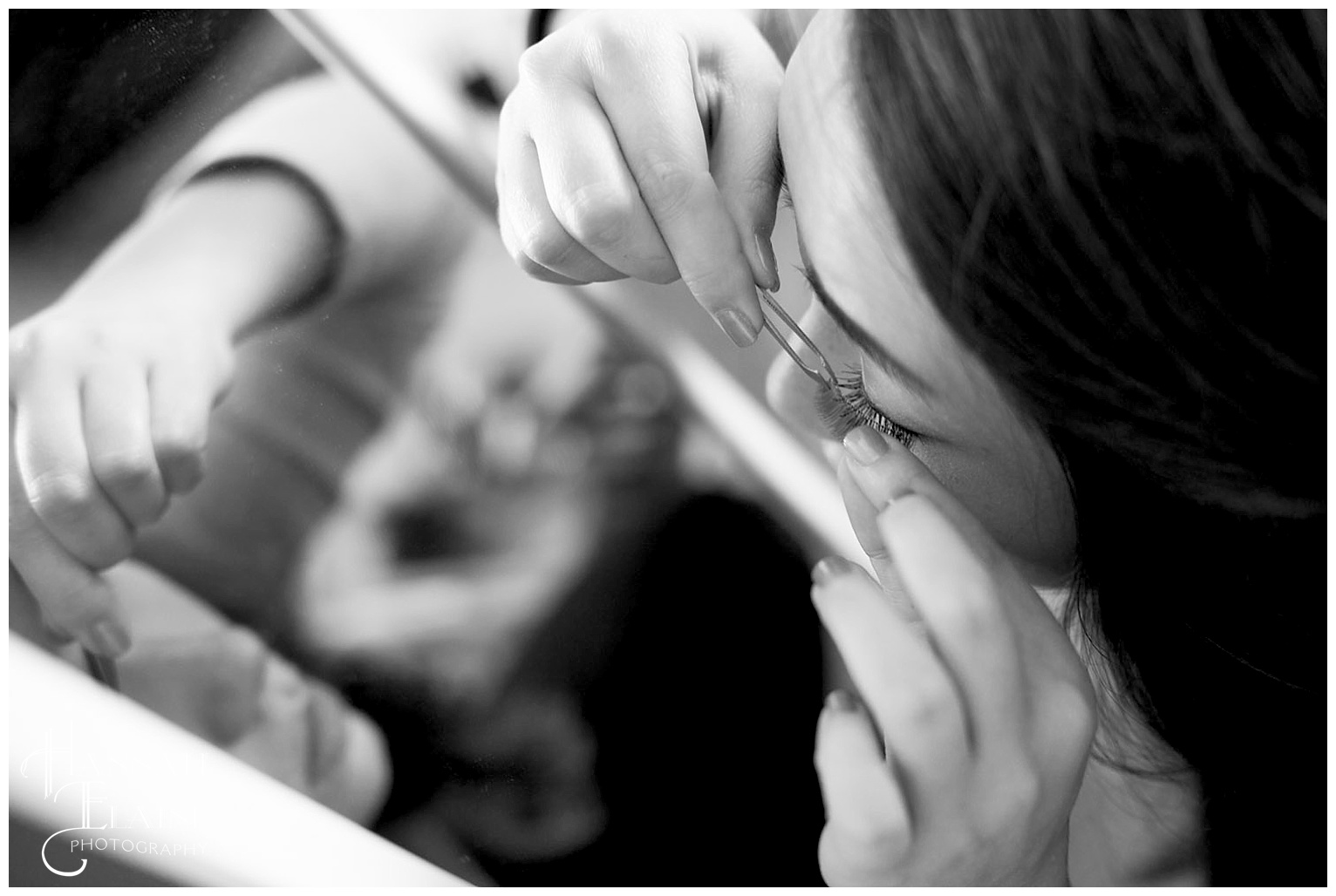 close up of bride putting on false eyelashes