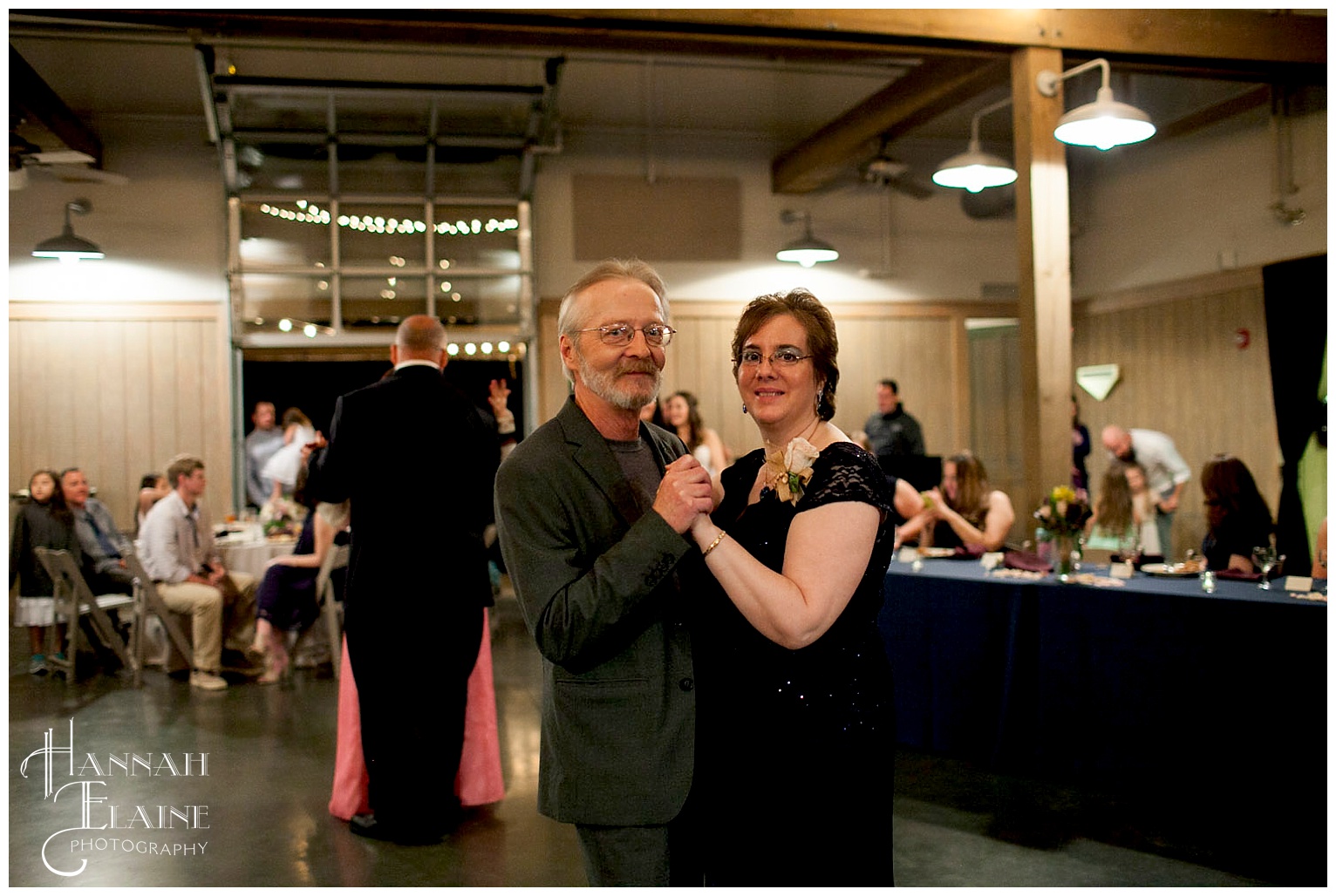 father of the groom shares a dance