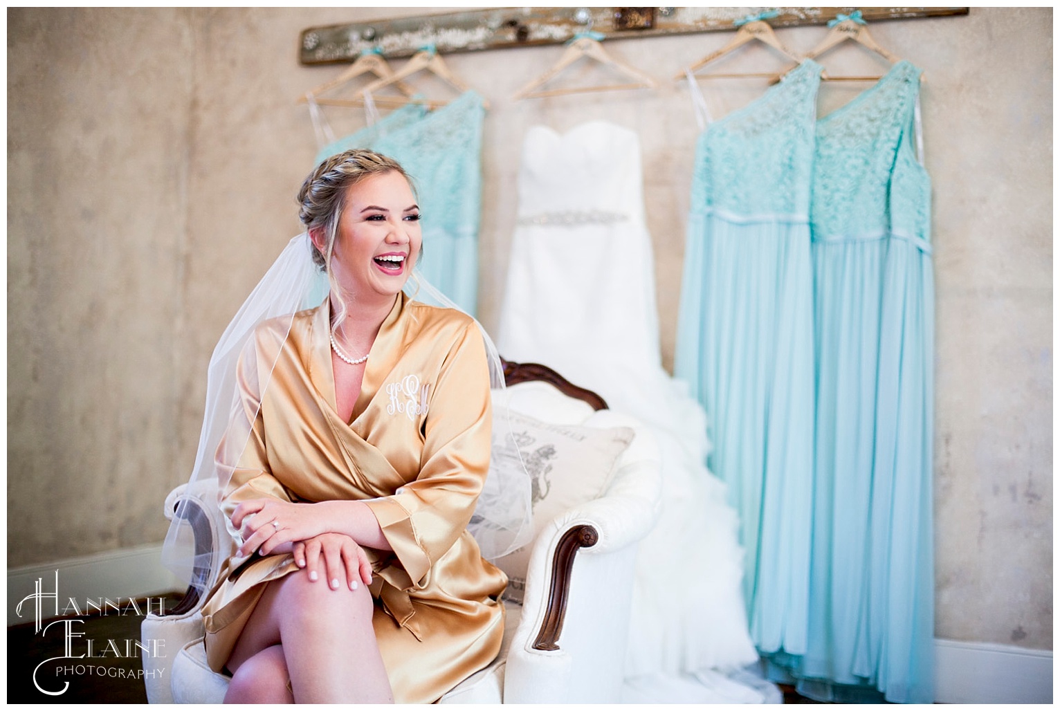 kayla in gold satin robe with wedding dress in background