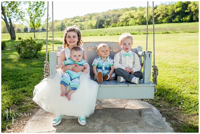 flower girl and ring bearers on the swing