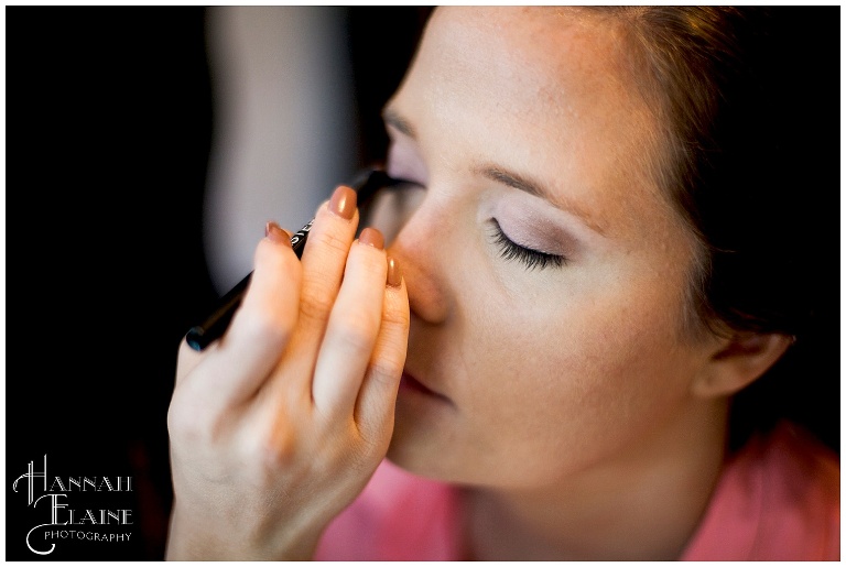 close up of bride getting eye makeup