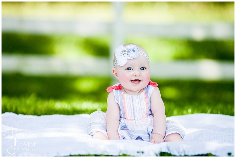 6 month baby girl with sparkle headband at gravel road traditions