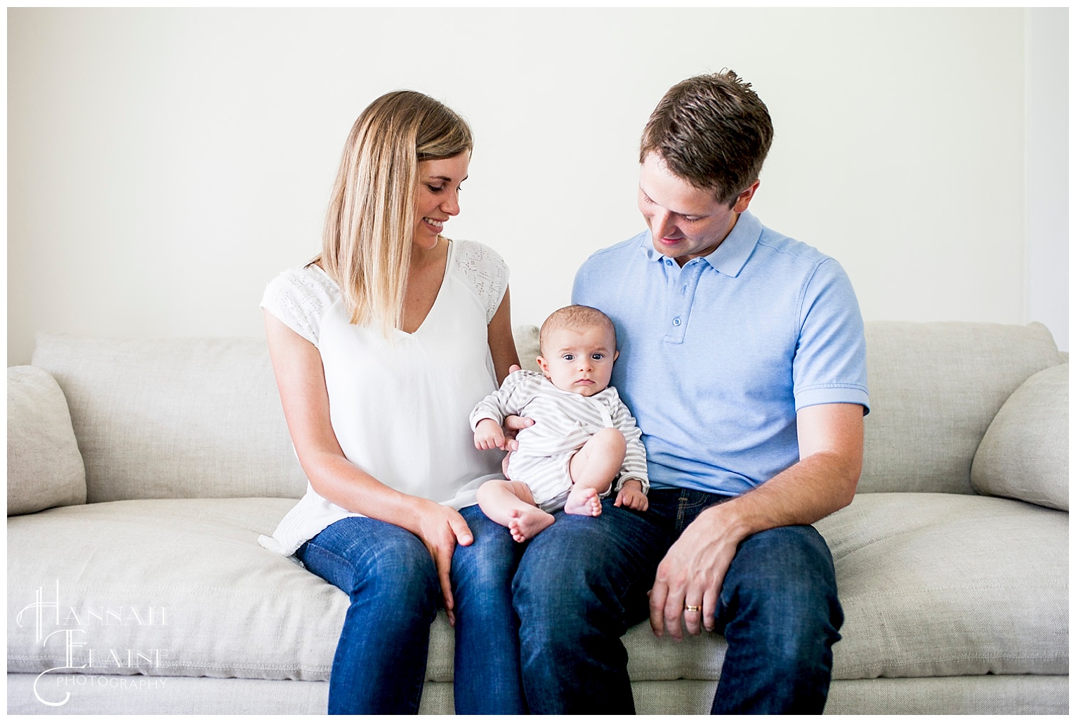 east nashville family of 3 on linen couch