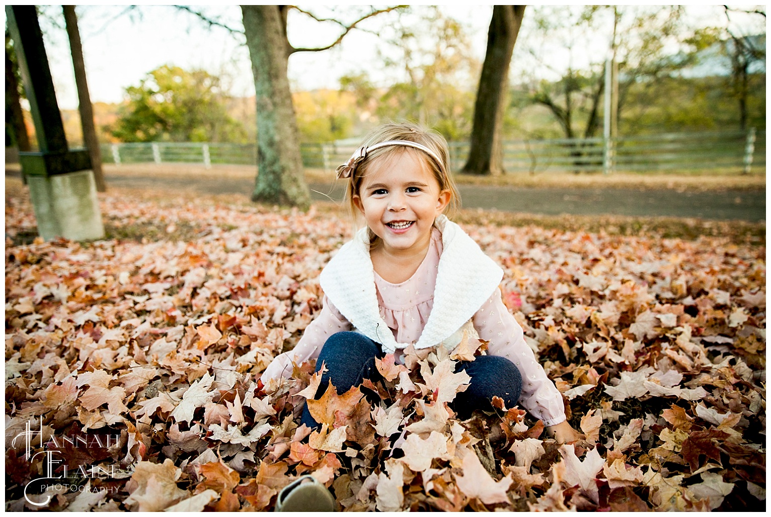 little girl laughs in the leaves ellington agricultural center