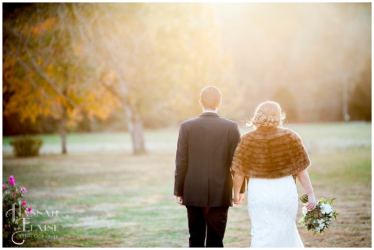vintage bride and groom walking into the sunset at drakewood