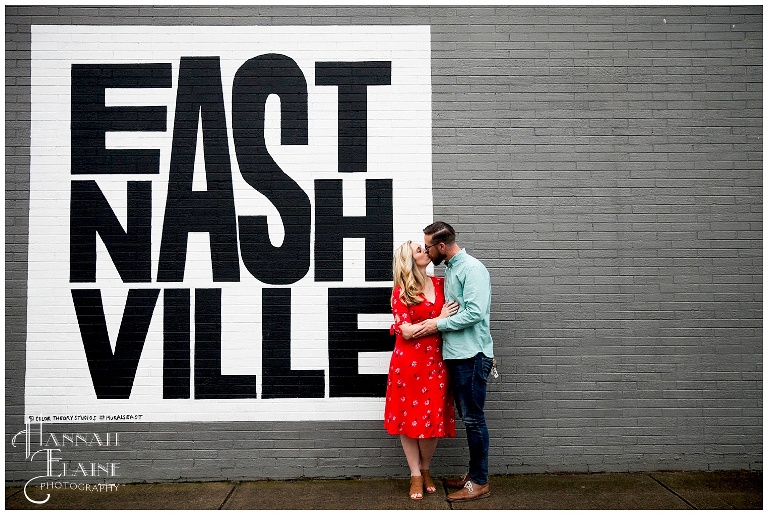 couple in front of east nashville mural