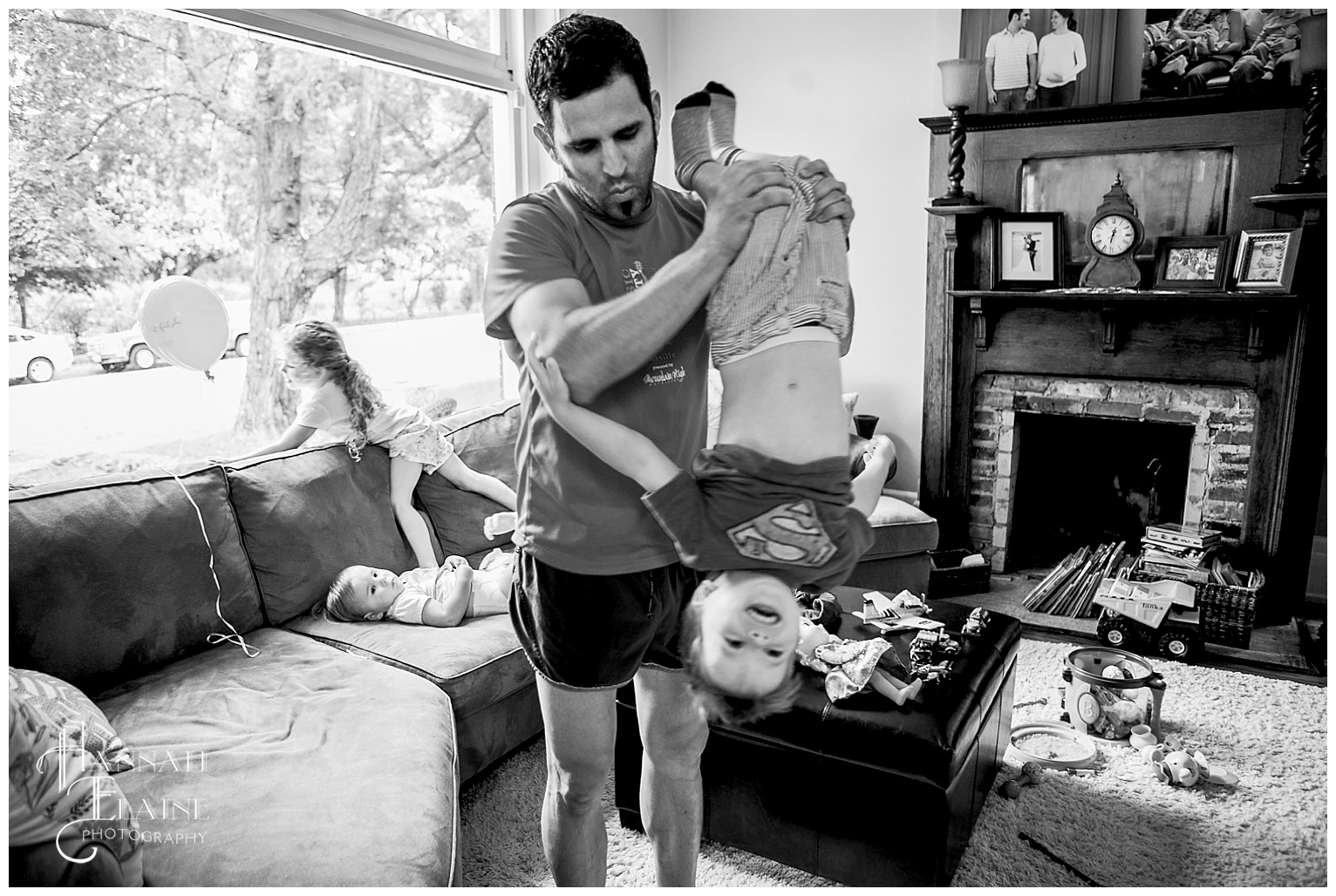 dad swings boy upside down on the way to nap time