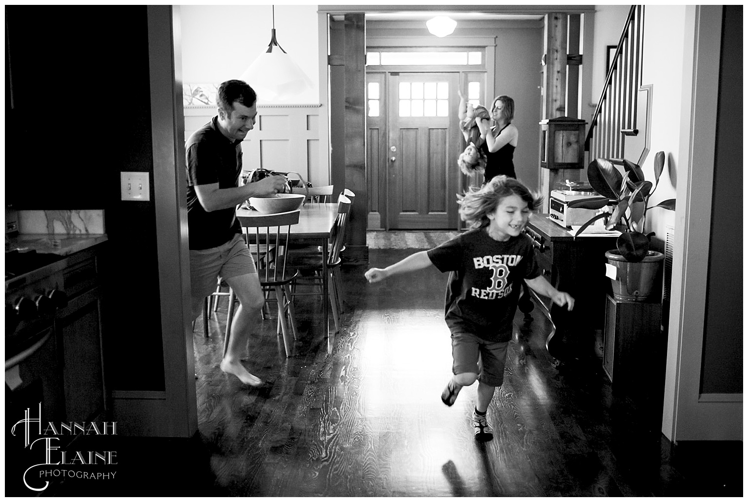 family plays tag and chases each other in the house