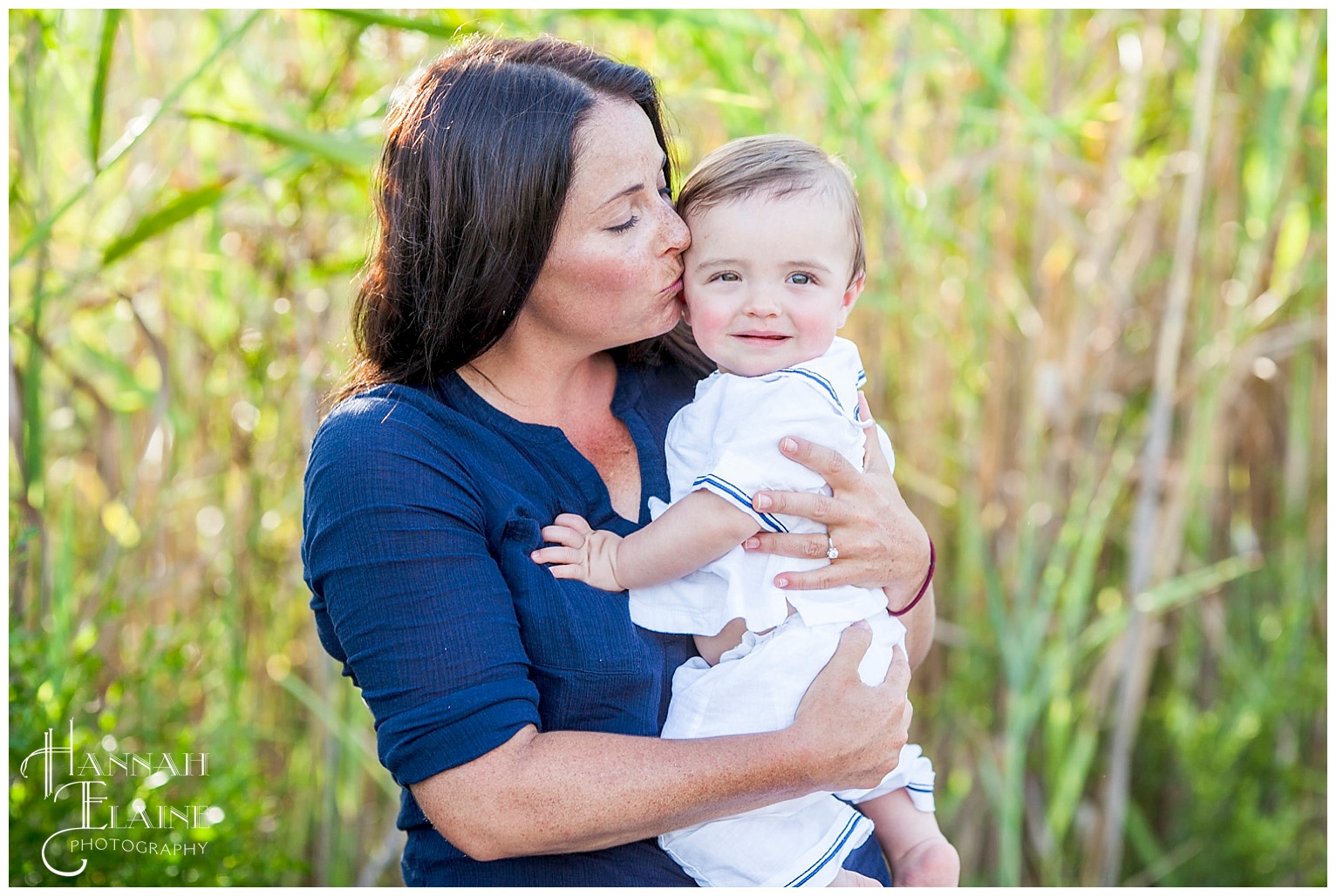 coastal momma kisses her son